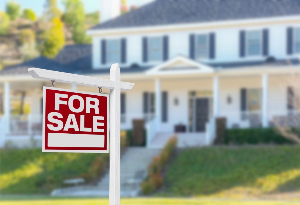 Home For Sale Sign in Front of New House